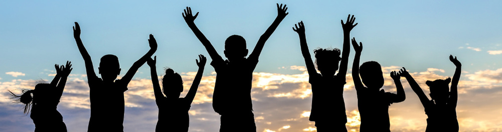 Silhouette of seven kids.