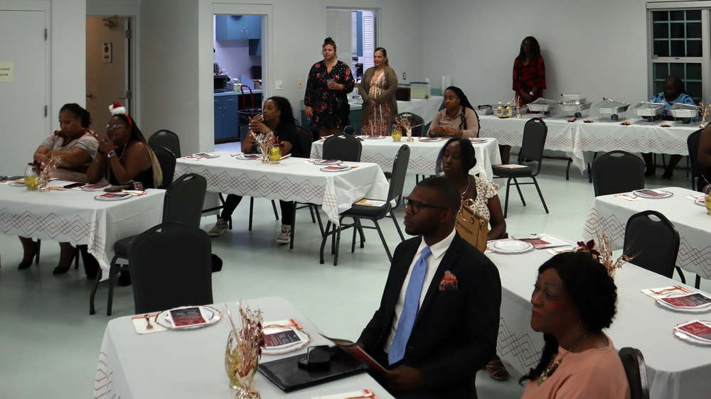 Group of people at the 2nd Annual Family Self-Sufficiency (FSS) Program End-of-Year Celebration and Recognition Ceremony on December 5, 2024.