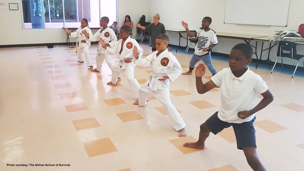 Young students of the Shihan School of Survival practicing martial arts.