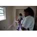 St. Petersburg Housing Authority (SPHA) team writing measurements for inside walls of Habitat for Humanity house.