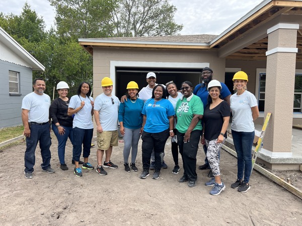 St. Petersburg Housing Authority (SPHA) team with Habitat for Humanity homeowner.
