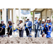 Several people holding shovels during the Shovel Ceremony at The Edward White Campus on August 27, 2024.