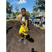 A young boy holding a shovel at the Jordan Park Community Garden on August 8, 2024.