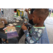 Child making holiday crafts at Very Merry Holiday Party in Jordan Park.