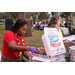 Woman wearing a red shirt with reindeer antlers and Domino's pizza at Very Merry Holiday Party in Jordan Park.