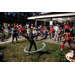 Children hula hooping with DJ in background at Very Merry Holiday Party in Jordan Park.